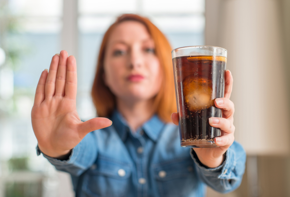 woman holding soda